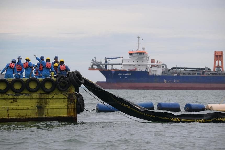 S'pore oil spill: Poor weather delayed laying of booms around damaged ship, says contractor