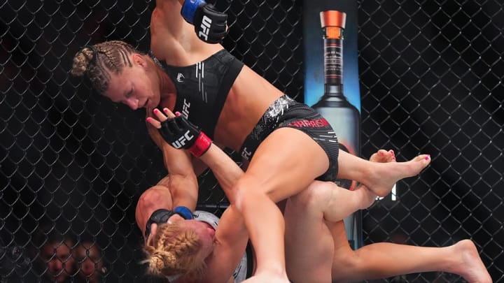 Harrison meets hype, taps out Holm in UFC debut