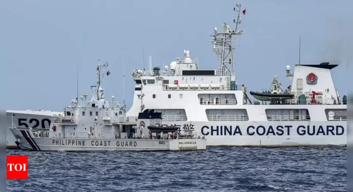 Philippines says China Coast Guard fired water cannon at its vessels - Times of India