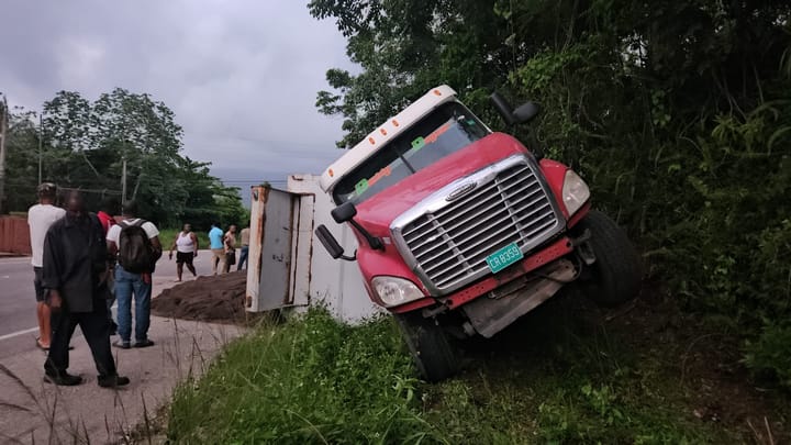 Sand truck overturns on Winston Jones Highway - Jamaica Observer